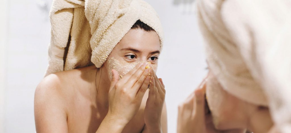 A girl scrubbing her face