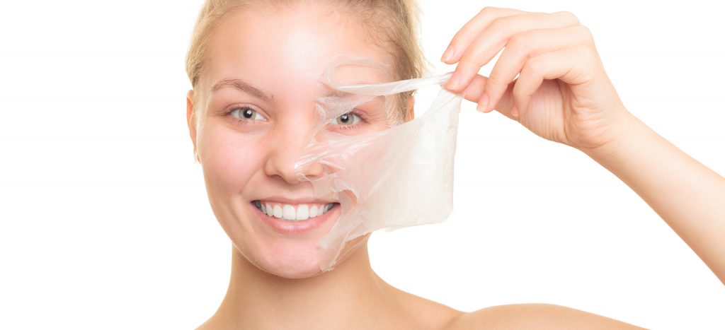 Woman Peeling Off Facial Mask