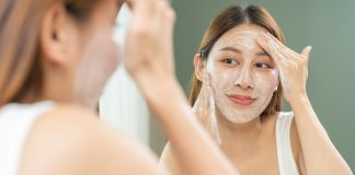 What Are the Benefits of Using Pink Clay & Charcoal Face Wash Women Applying Face Scrub